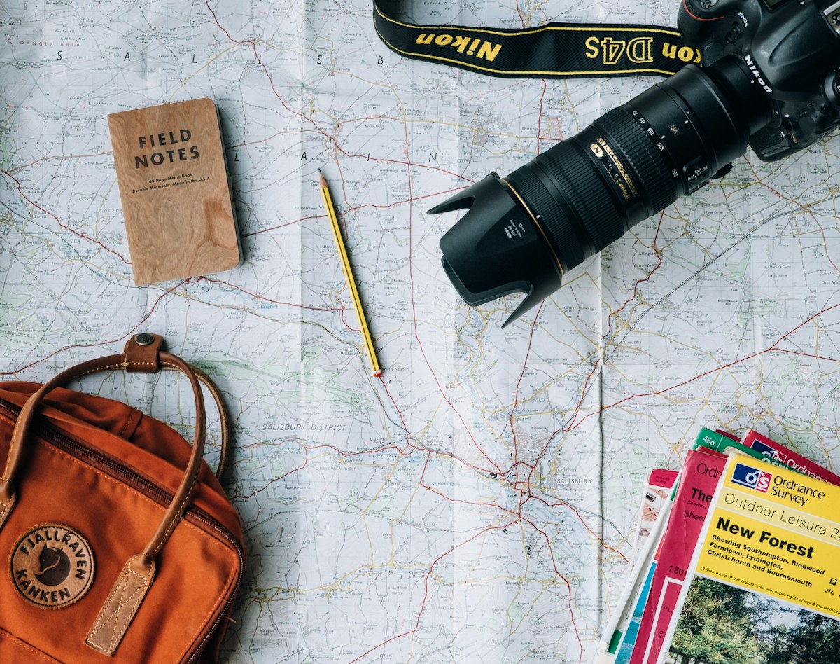 Travel planning materials with a map and camera